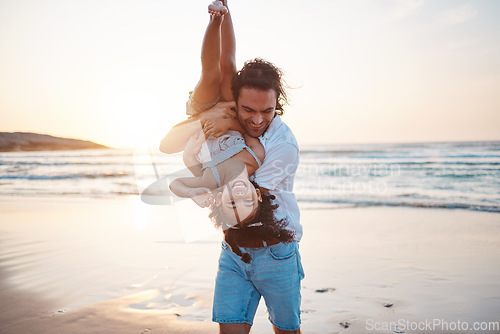 Image of Beach, sunset and father play with girl on holiday, vacation and adventure. Happy family, adoption and child laughing with dad by ocean for bonding, healthy relationship and fun outdoors in summer