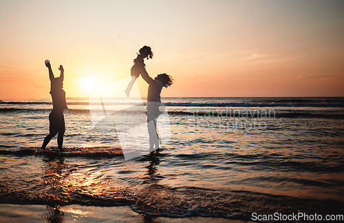 Image of Silhouette, sunset and dad lifting child in air at beach with lgbt family and waves in the ocean with fun and support on adventure. Gay parents, kid and father play with girl in the sea with love