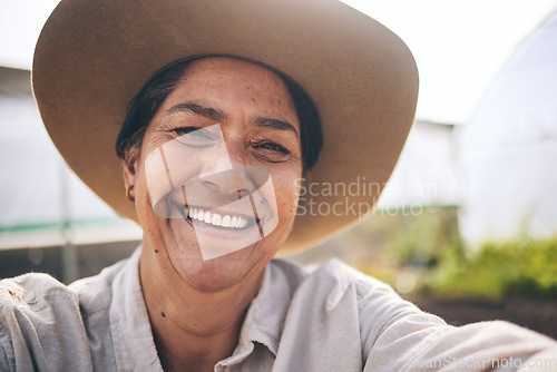 Image of Farming, smile and selfie of woman in greenhouse, sustainable small business and agriculture. Portrait of happy, mature farmer at vegetable farm in summer with growth and development with agro plants