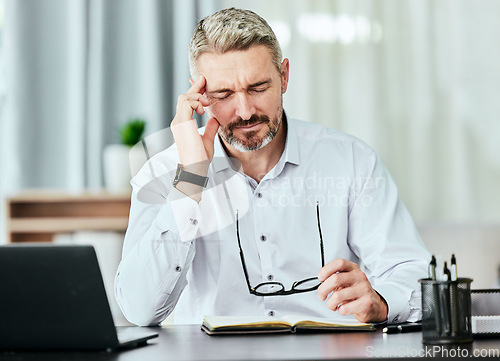 Image of Stress, anxiety and mental health with a business man in the office, working on a laptop for his report deadline. Burnout, headache and tax with a corporate manager overwhelmed by a financial crisis