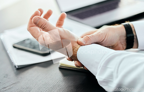 Image of Business, wrist pain and hands of man in office holding for injury, inflammation and joint strain. Stress, medical emergency and closeup of worker with problem, crisis and carpal tunnel for writing