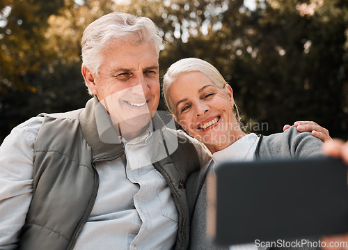 Image of Senior couple, outdoor hiking and selfie with smile, web blog and memory in nature, sunshine and adventure. Elderly man, woman and together with social media, photography and profile picture in woods