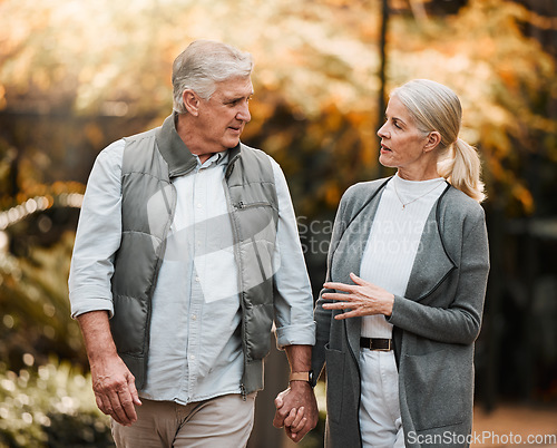 Image of Love, park or couple holding hands, walking and enjoy time together, relax conversation and nature. Wellness, marriage and elderly people on romantic date, outdoor freedom or talking about retirement