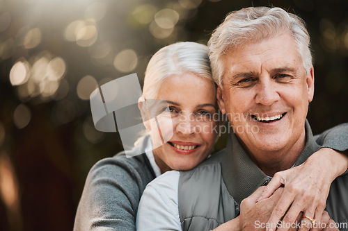 Image of Love, portrait and senior couple hug at a park happy, free and enjoy travel, holiday or weekend. Face, smile and elderly woman embrace man in forest, bond and having fun on retirement trip together