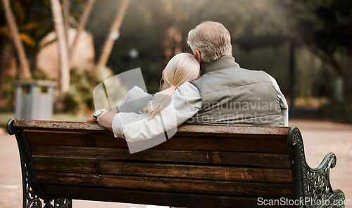 Image of Park bench, back or relax couple hug, bond and cuddle together, connect and enjoy quality time, fresh air or outdoor nature break. Natural wellness, freedom or marriage people support, care and trust