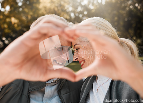 Image of Love, park and senior happy couple with heart hands for retirement health, marriage bond and romantic date symbol. Support, emoji icon and outdoor man, old woman or people smile for nature wellness