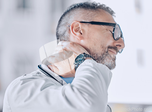 Image of Medical, neck pain or optometry and a doctor in his office with an injury while feeling stress. Healthcare, burnout or accident with a mature optician holding his spine or shoulder in a clinic