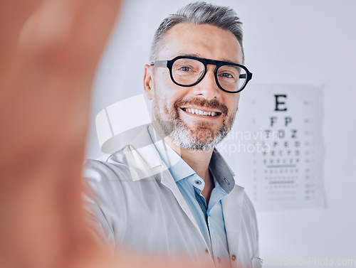 Image of Selfie, glasses and eye exam with an optometrist man in his office for healthcare or vision improvement. Medical, portrait and eyewear with a doctor or optician in a clinic for assessment and testing