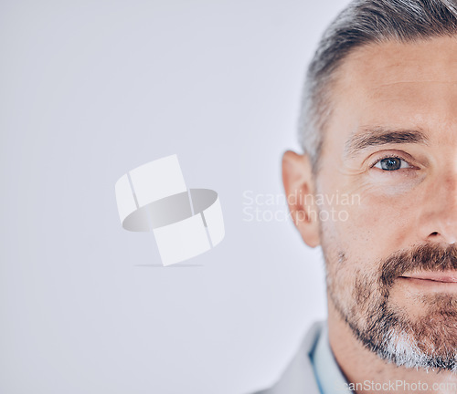 Image of Doctor man, headshot portrait and space for mock up, promotion and healthcare employee in hospital. Medical professional, expert and mature leader with face by wall background for wellness in clinic