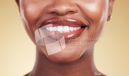 Image of Woman, mouth and teeth, natural beauty and dental with cosmetics, skin and closeup isolated on yellow background. Smile, lipstick and makeup with dental health, shine and dermatology in a studio