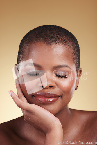 Image of Beauty, natural makeup and face a black woman in studio for skincare, glow and cosmetics. Headshot of African person with facial shine, dermatology and self care for wellness on beige background