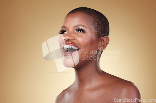 Image of Beauty, laughing and a black woman with makeup in studio for skin care, glow and cosmetics. Face of a happy african person or model with facial shine, dermatology and wellness on a beige background