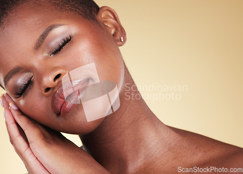 Image of Makeup, black woman and face with beauty in studio for skin care, glow and cosmetics. Headshot of african person or aesthetic model with facial shine, dermatology and wellness on a beige background