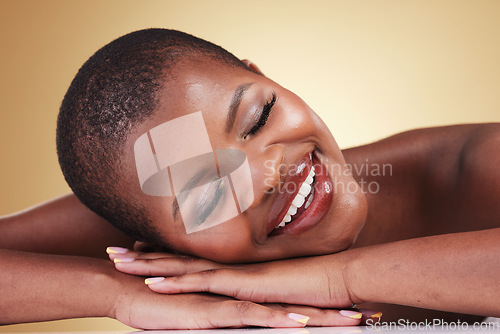 Image of Makeup, face and beauty of happy woman in studio for self care, skin glow or cosmetics. Closeup of African aesthetic model person with facial shine, dermatology or relax on hands on beige background