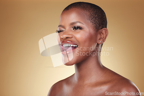 Image of Makeup, tongue out and black woman wink in studio for cosmetic wellness on brown background space. Beauty, face and African model with crazy emoji expression and glowing skin, results or satisfaction