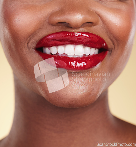 Image of Red lipstick, woman with beauty and mouth, teeth and makeup and smile closeup isolated on studio background. Bold cosmetic product, lips and dental health, elegance and glamour with color and glow