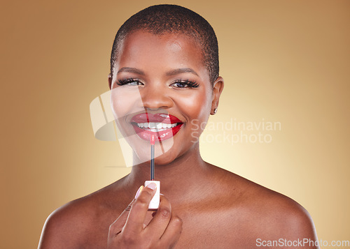 Image of Beauty, makeup brush and a woman with red lipstick in studio for portrait, glow or cosmetics. Face of happy African person with facial shine, dermatology and application on lips on a beige background