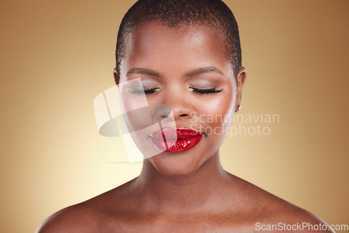 Image of Red lipstick, makeup and a black woman with beauty in studio or skin care, glow and cosmetics. Face of an African person or model with facial shine, dermatology and wellness on a beige background