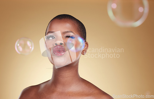 Image of , makeup and bubbles with face of black woman in studio for cosmetics, spa treatment and luxury. Skincare, dermatology and self care with model on gold background for glow, facial and soap mockup