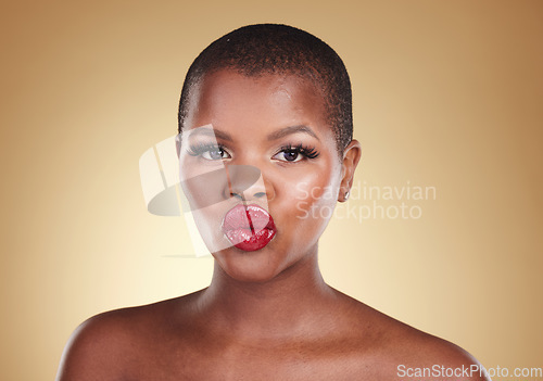 Image of Black woman, lips and kiss, red lipstick and beauty with makeup and portrait isolated on studio background. Pout, cosmetics product on mouth and bold color with headshot, shine and cosmetology