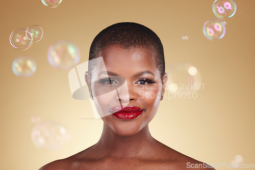 Image of Beauty, makeup and bubbles with portrait of black woman in studio for cosmetics, spa treatment and luxury. Skincare, dermatology and self care with model on gold background for glow, facial and soap