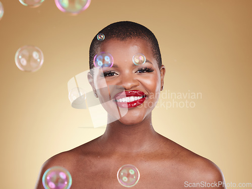 Image of Smile, makeup and bubbles with portrait of black woman in studio for cosmetics, spa treatment and luxury. Skincare, dermatology and self care with model on gold background for glow, facial and beauty