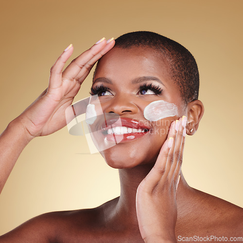 Image of Skincare, smile and face cream for black woman in studio happy, dermatology or cosmetic results on brown background. Beauty, glow and model with facial, sunscreen or collagen or vitamin c application