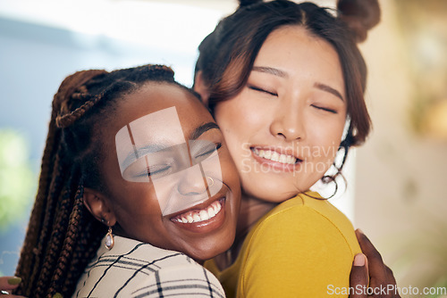 Image of Happy, smile and lesbian couple hugging with love, care and excitement together in the living room. Happiness, pride and interracial young lgbtq women bonding for affection moment in modern apartment