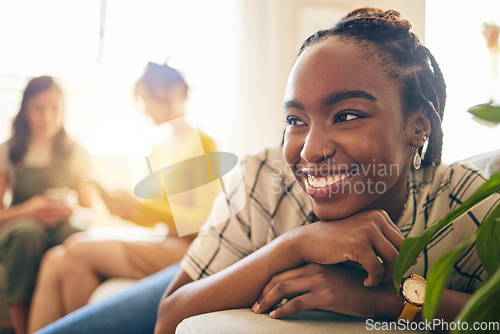 Image of Happy, thinking and black woman relaxing in the living room with her friends in modern apartment. Happiness, positive and young African female person dreaming and sitting in lounge for rest at home.