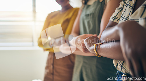 Image of Holding hands, arms crossed and unity with business women in a row for equality or empowerment. Support, teamwork or collaboration with a creative employee group in the office for partnership closeup