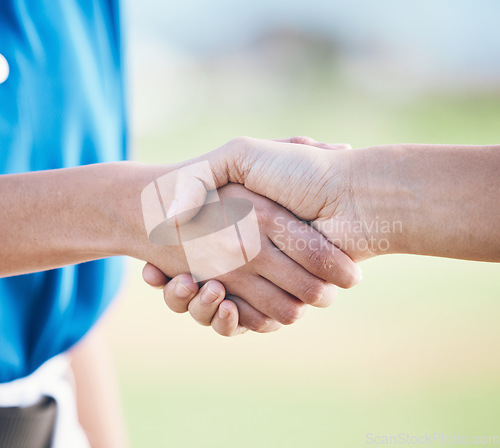 Image of People, handshake and sports in agreement, teamwork or partnership on outdoor baseball field together. Players or person shaking hands in thank you, support or trust for unity, deal or motivation