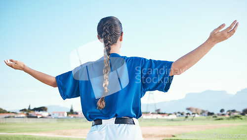 Image of Woman, arms raised and winner with cheers, softball and sports with athlete on outdoor pitch and back view. Pray, hope and freedom, celebration and exercise, baseball player and winning competition