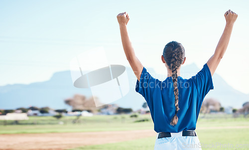 Image of Woman, fist pump and winning, softball and athlete on outdoor pitch, celebration and success with sports. Back view, baseball player and yes, fitness and achievement, cheers and competition winner