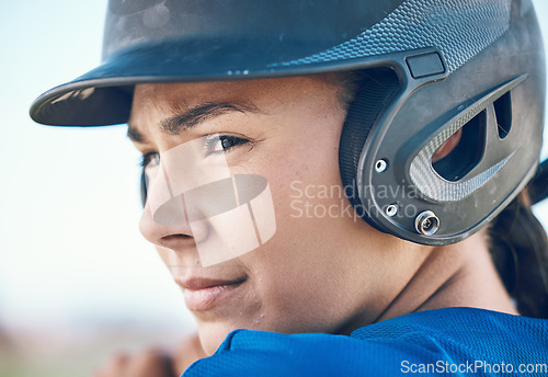 Image of Baseball, face and a person with a helmet outdoor on pitch for sports performance or competition. Professional athlete or softball woman with commitment and fitness for game, training or exercise