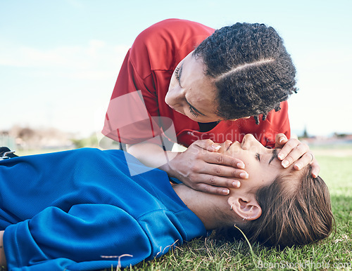 Image of CPR, breathing check and saving woman on field for sport, fitness and game with accident and emergency. Training, paramedic and listening to lungs for breathe from injury with first aid and athlete