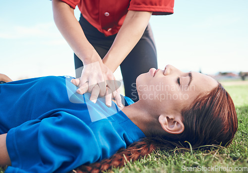 Image of Cpr, outdoor and hands on chest, women and help on a field, resuscitation and medical emergency. Closeup, player outside and heart attack with volunteer, accident and first aid to rescue a person