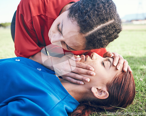 Image of CPR, breathing check and woman on field for sport, fitness and game with accident and emergency. Training, paramedic and listening to lungs for breathe from injury with first aid and athlete outdoor