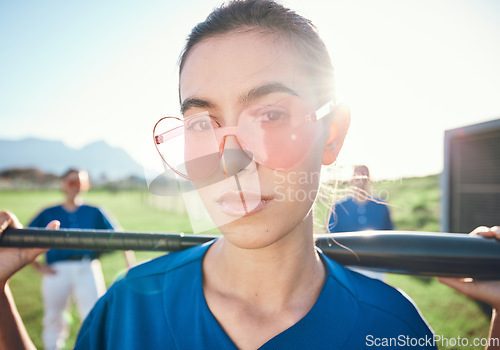 Image of Baseball player, sunglasses and a sports person with bat outdoor on pitch for performance at competition. Face of athlete or softball woman for portrait, commitment or fitness for game or training