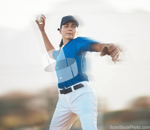 Image of Baseball, ball and a woman pitching outdoor on a sports pitch for performance and competition. Professional athlete or softball pitcher with fitness for game, training or exercise on field or stadium