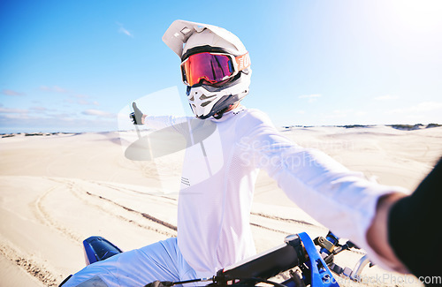 Image of Selfie, motorcycle and man in desert adventure, nature and sports outdoor on mockup space. Bike, helmet and person take picture at sand for social media, transportation and off road travel in Morocco