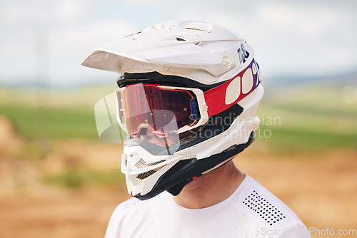 Image of Sports, motorcycle and man with helmet in the countryside for fitness, practice or speed training. Motorbike, safety and male driver with head gear, protection and neon glasses for off road adventure