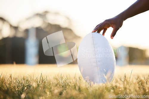 Image of Sports, rugby and hand of person with ball ready for game, competition and tournament outdoors. Fitness, mockup and closeup of player on grass field for exercise, training and workout in practice