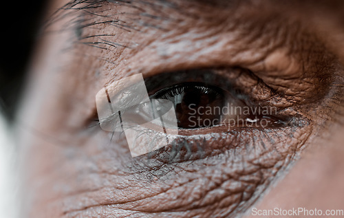 Image of Eye, vision and wrinkles with a senior person closeup for sad emotion, pain or grief on an expressive face. Healthcare, depression or loss with an elderly adult looking nostalgic during retirement