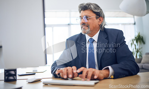 Image of Computer, typing and businessman working in the office on legal corporate project on the internet. Technology, professional and mature male lawyer doing research for law data for a case in workplace.