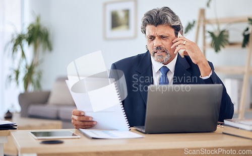 Image of Document, laptop and businessman on a phone call in the office while talking to a client. Discussion, technology and mature professional male lawyer on mobile conversation with paperwork and computer