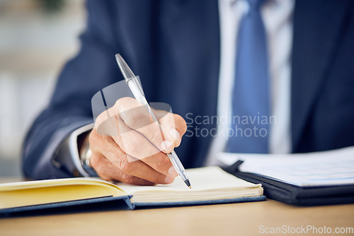 Image of Hand, pen and writing in a notebook with a manager at a desk in his office closeup to schedule an appointment. Planning, management and journal with a business man in the corporate workplace