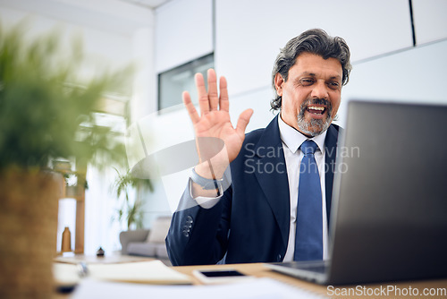 Image of Discussion, video call and businessman with a laptop in the office for a team management webinar. Greeting, professional and mature male manager in a virtual meeting with a computer in the workplace.