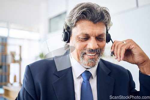 Image of Senior businessman, call center and consulting in customer service, support or financial advisor at office. Mature man, consultant or agent smile with headphones in online advice or help at workplace