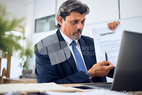 Image of Contract, video call and businessman with a document in the office talking to an online client. Discussion, paperwork and mature professional male lawyer in a virtual meeting on a laptop in workplace