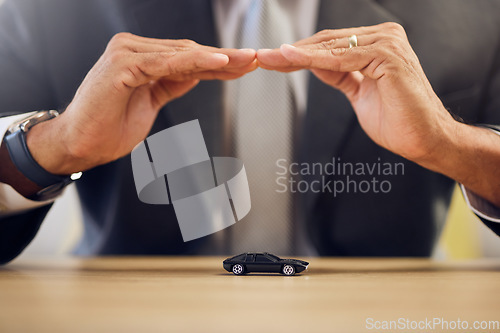 Image of Investment, hands and person with car insurance or covering for safety or business. Office, protection and man with shelter or security for transportation, guarantee or premium support for a vehicle